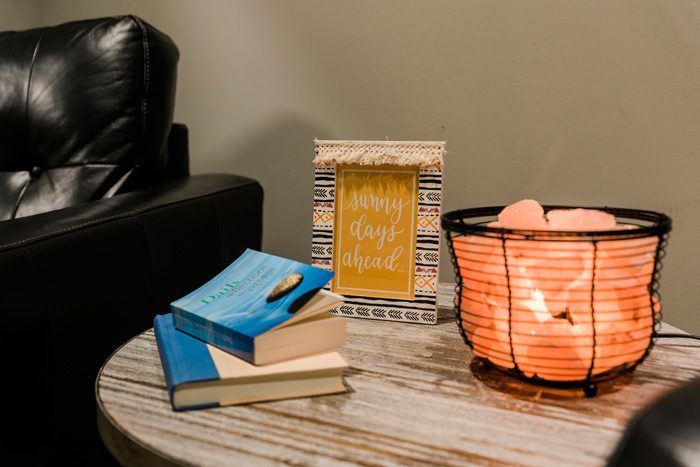 small table with salt lamp and devotional recovery books - Victory Addiction Recovery Center - inpatient addiction treatment in Louisiana