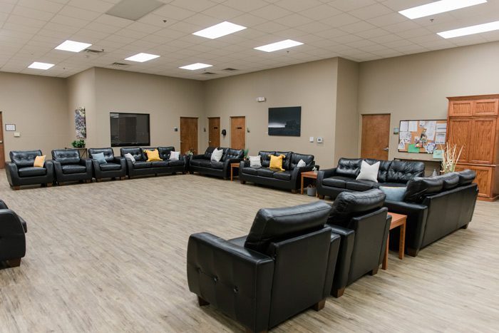 recliners and couches set up in day room - Victory Addiction Recovery Center - Lafayette drug and alcohol treatment
