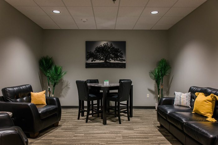 comfortable room with table and chairs and couch - - Victory Addiction Recovery Center - Louisiana addiction recovery center