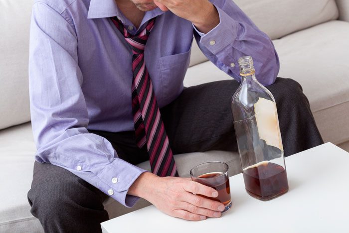 warning signs of alcoholism - victory addiction recovery center - man drinking