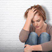 factors that contribute to drug addiction - depressed woman - victory addiction revocery center