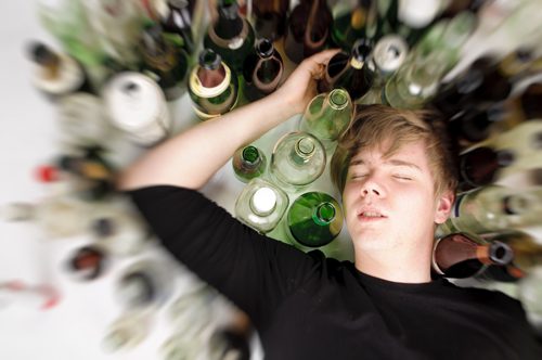 Alcohol Abuse in College - college student with alcohol - victory addiction recovery center