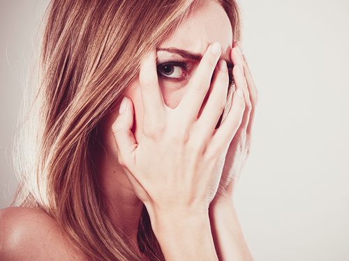 Are You Afraid of Getting Sober? - afraid woman peeking through her fingers