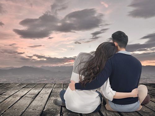 7 Ways to Restore Trust with a Loved One After Recovery - couple sitting on a pier