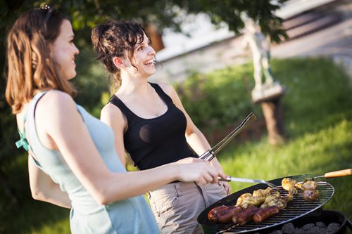 Fun in the Sun While Staying Sober - two women at a cookout