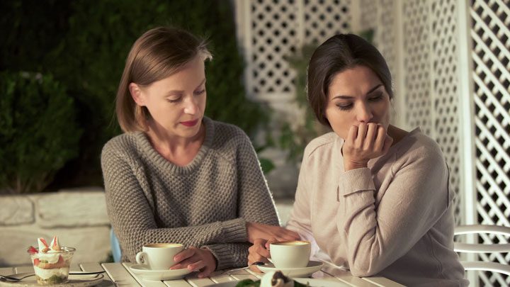 mom talking to adult daughter