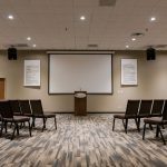 room set up for speaker with chairs and podium - Victory Addiction Recovery Center - addiction treatment programs in Louisiana