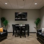 well decorated room with table and chairs, couch - Victory Addiction Recovery Center - Louisiana addiction treatment center