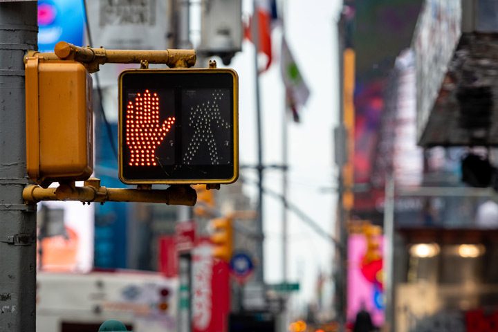 do not walk red hand signal at crosswalk on busy city street - inpatient drug addiction treatment