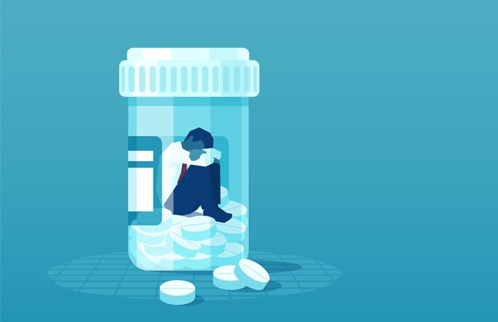 illustration in blue tones of man trapped inside bottle of pills - Xanax addiction