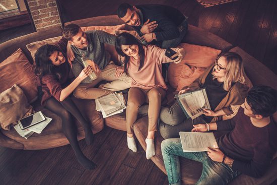Can-a-Taste-of-Independence-in-College-Lead-to-Addiction - friends studying and hanging out in loft apartment