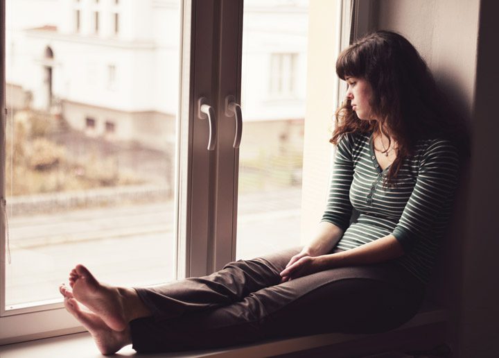 young woman looking sad