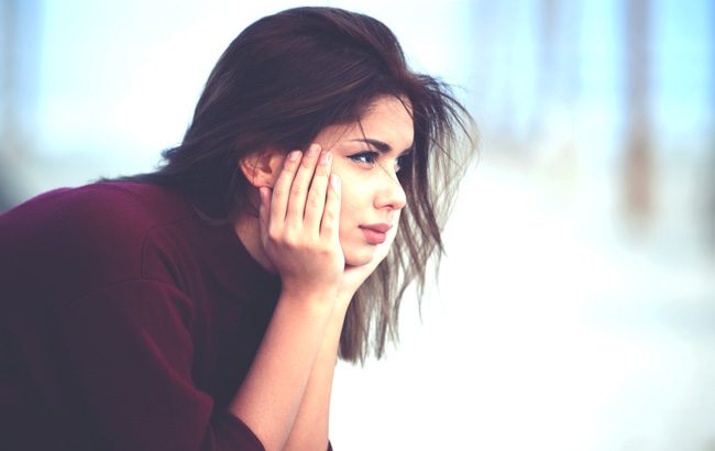 Helping-Teens-Safely-Cope-with-a-Family-Members-Addiction - dark haired teen girl with hands on face
