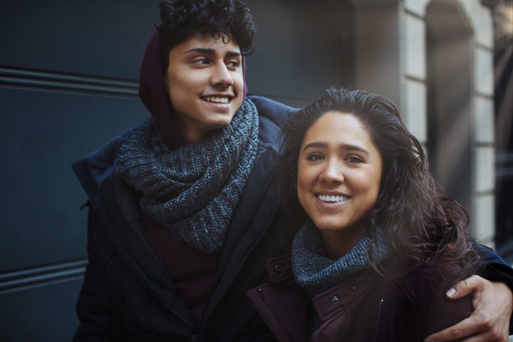 brother and sister smiling with arms around each other - rebuild trust