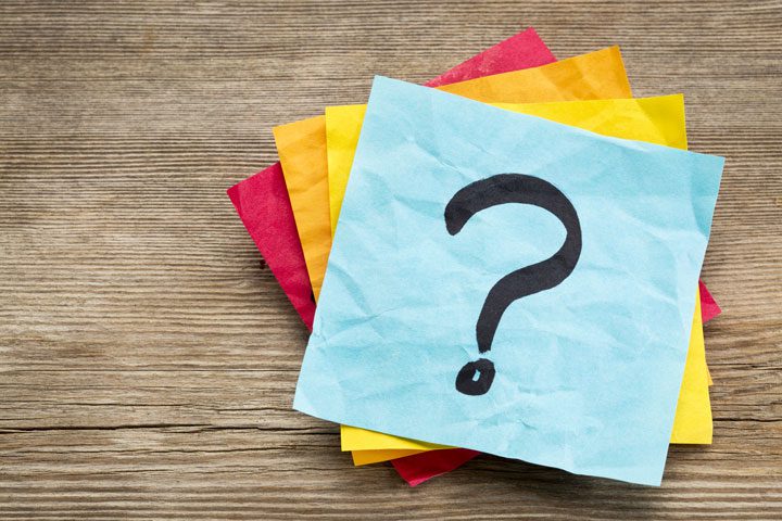 stack of post-it notes with question mark - IOP