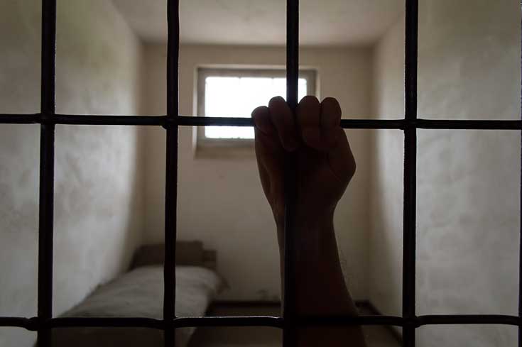 addiction consequences hand behind bars - my victory center