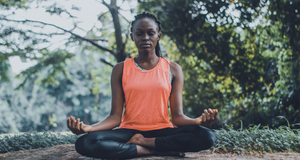 A woman in a meditation pose.
