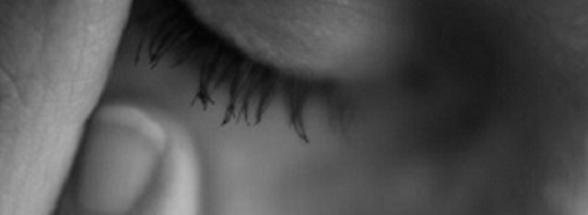 black and white photo of a sad woman - suicide awareness and prevention at Victory Addiction Recovery Center