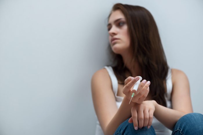 why are drugs so addicting - woman with heroin needle - victory addiction recovery center